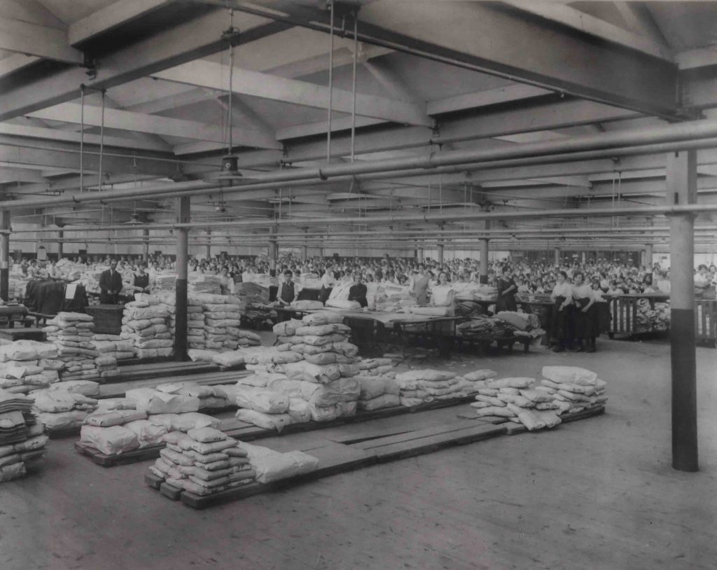 Factory Workers with Shirts packed and ready to go circa the 1940's